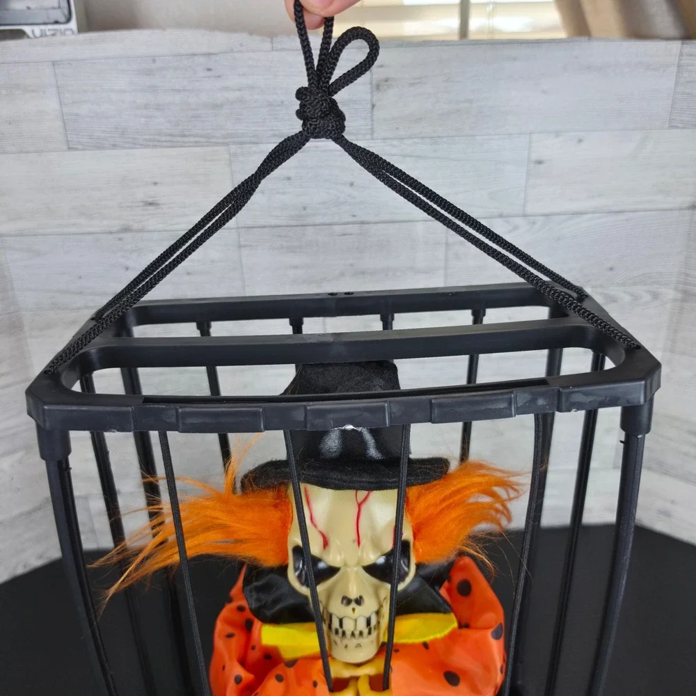 Halloween Animated Skeleton Clown in Cage Hanging Prop Orange Black Skull Decor